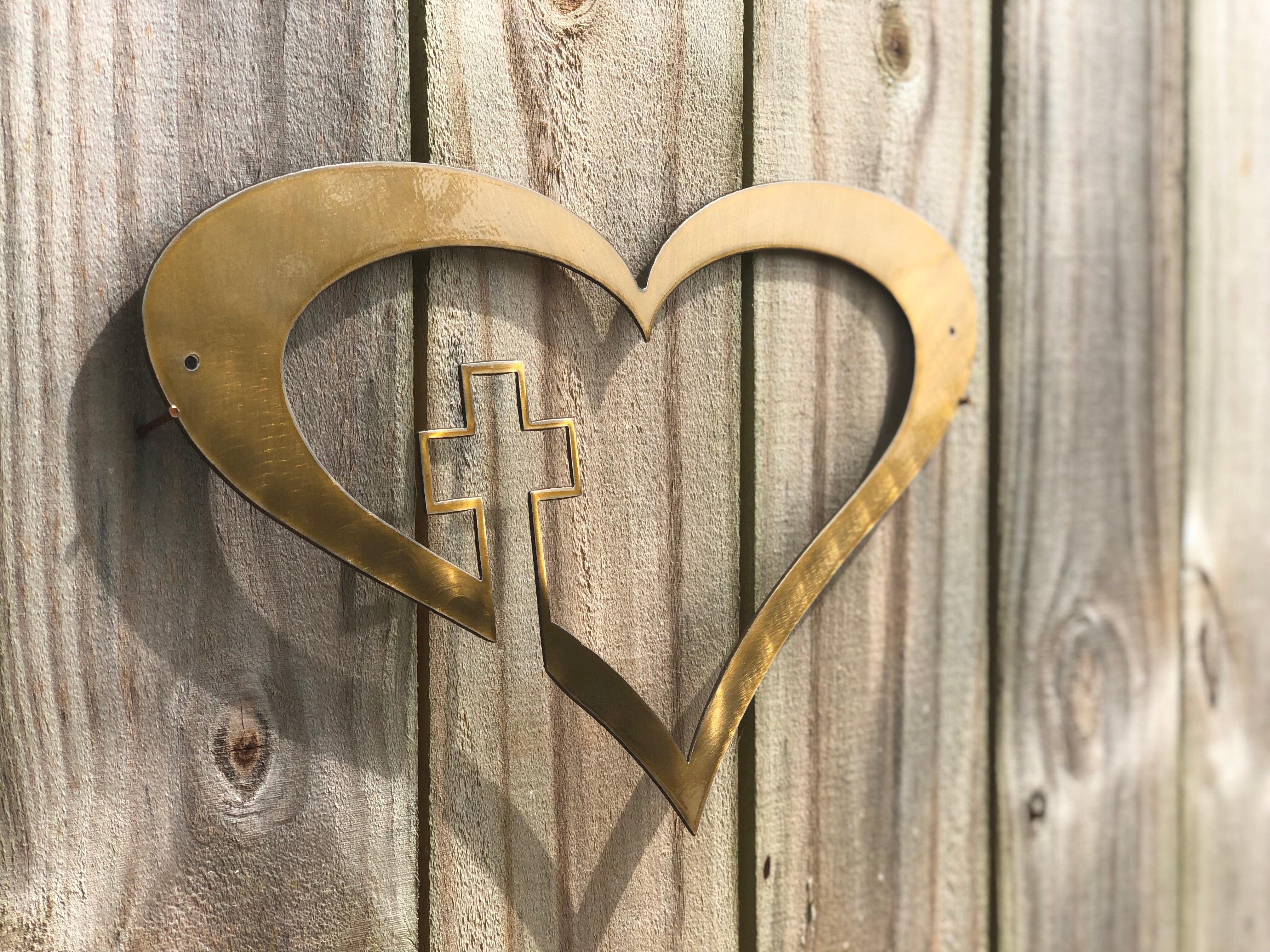heart with cross metal sign